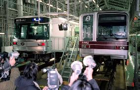 2 subway train cars towed to inspection facility